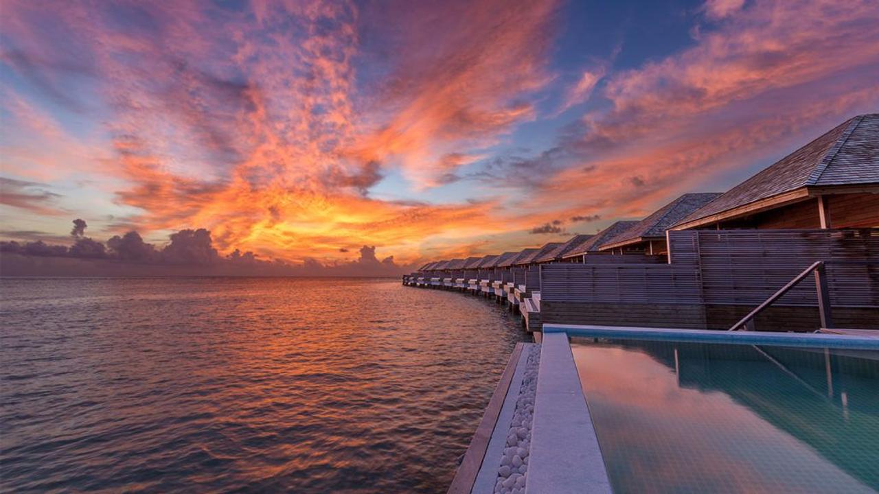 Sunset over villas at Hurawalhi