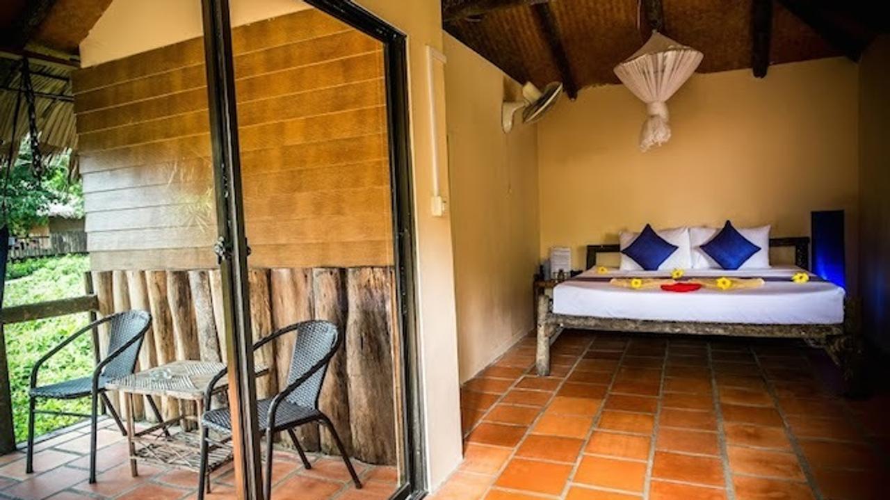 Bedroom with balcony at Rainbow Lodge