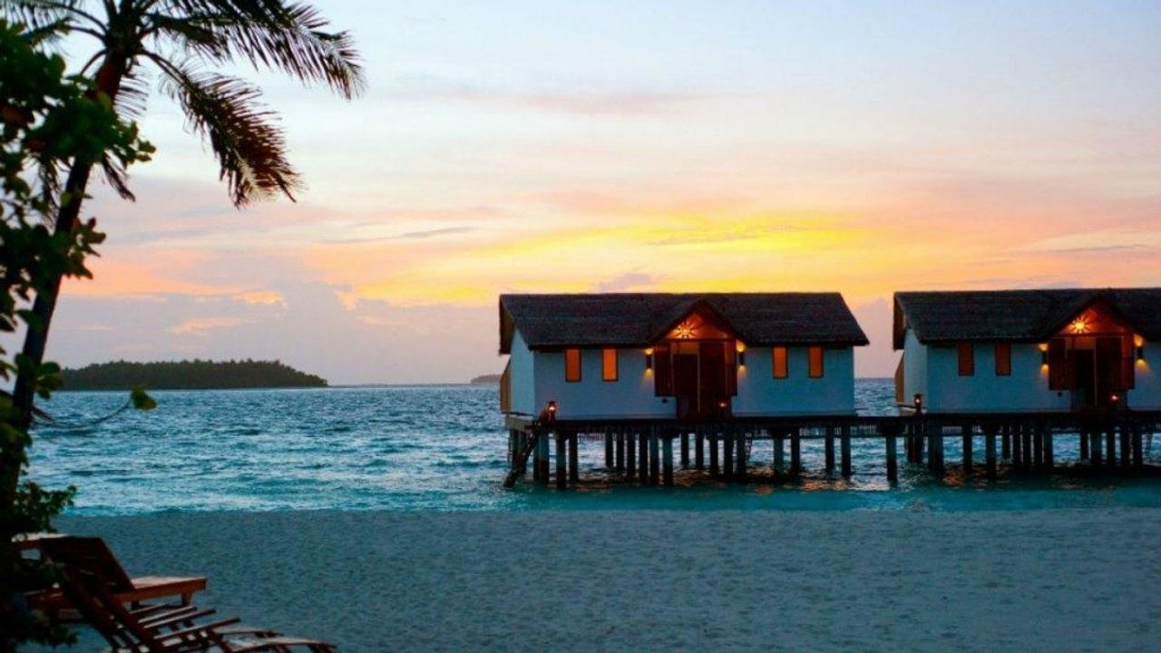 Villas at sunset at Reethi Beach